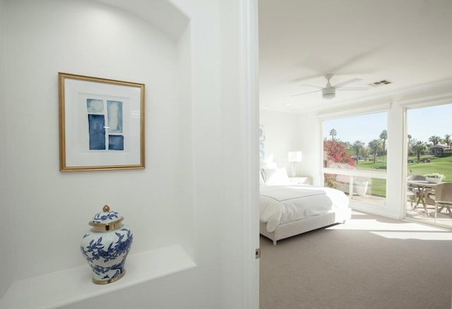 carpeted bedroom with ceiling fan