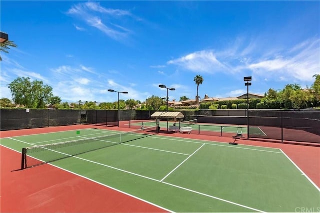 view of sport court with basketball hoop