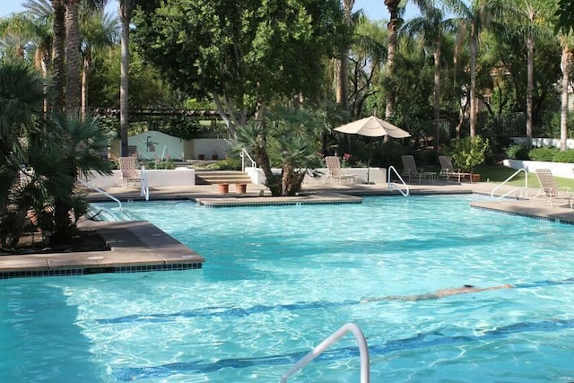 view of swimming pool featuring a patio area