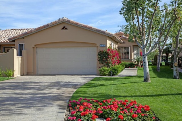 view of front of property with a garage and a front yard