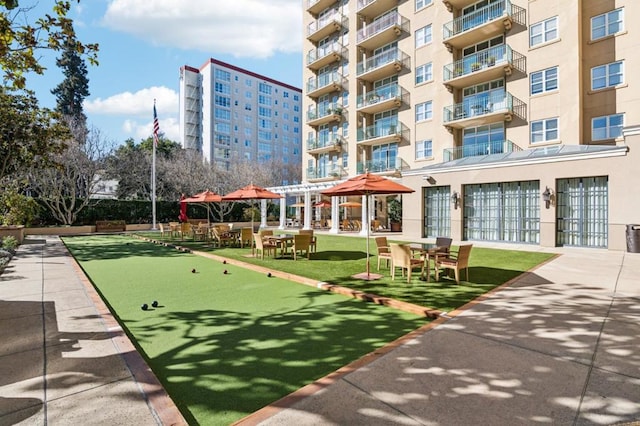 view of property's community featuring a pergola