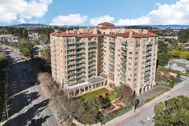 view of building exterior featuring a mountain view