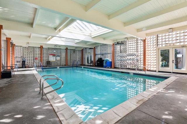 view of pool with french doors