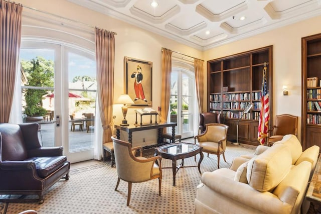 living area with coffered ceiling, a wealth of natural light, and french doors