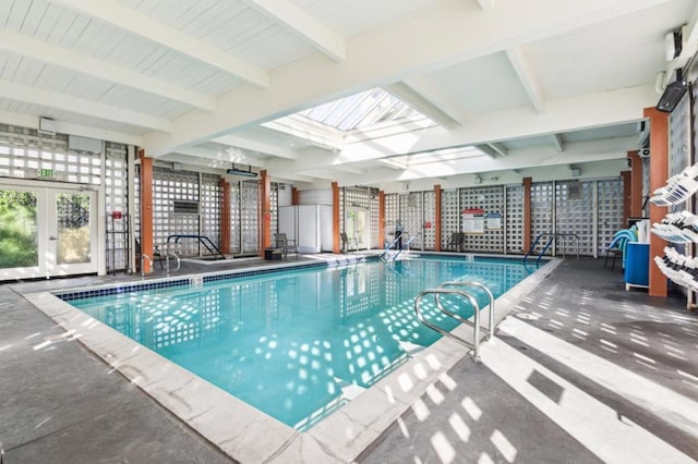 view of pool featuring french doors