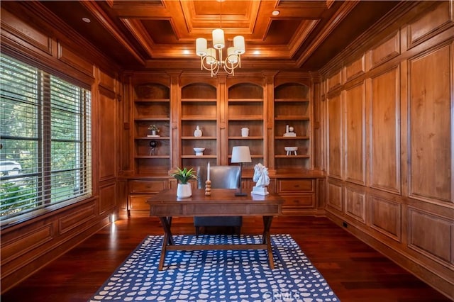 unfurnished office featuring a healthy amount of sunlight, wooden walls, and crown molding