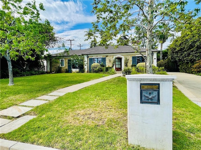 ranch-style house with a front yard