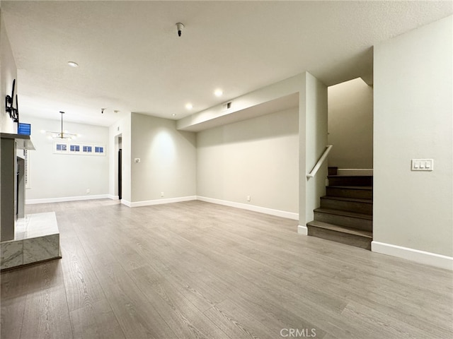 basement featuring wood-type flooring