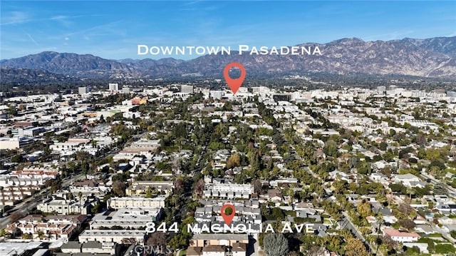 birds eye view of property featuring a mountain view