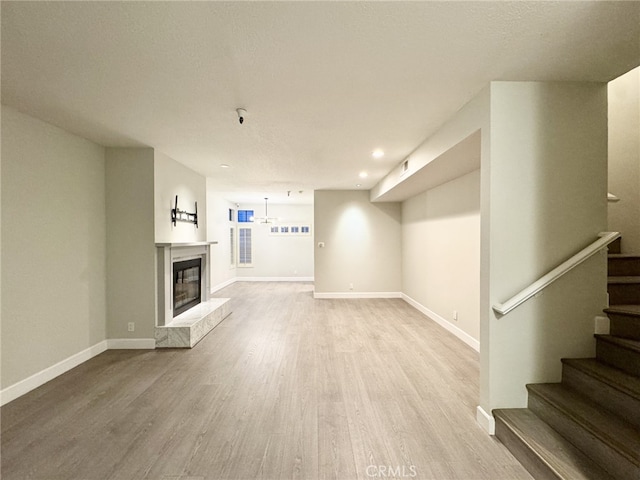 unfurnished living room with light wood-type flooring