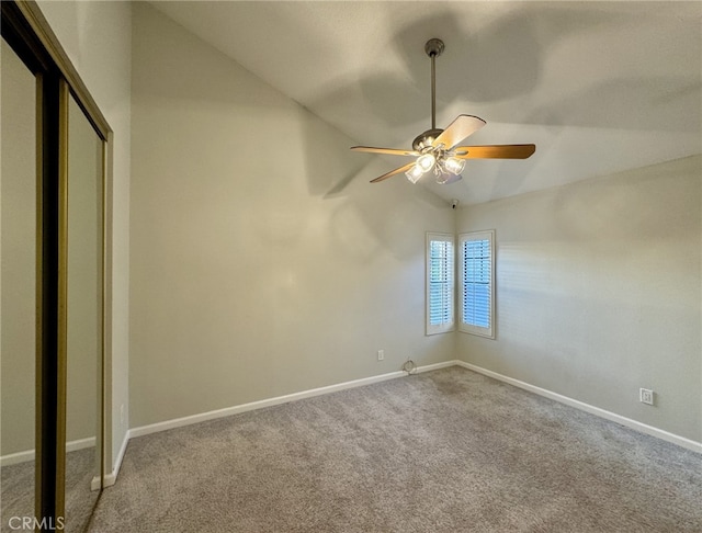 unfurnished bedroom with ceiling fan, a closet, carpet, and baseboards