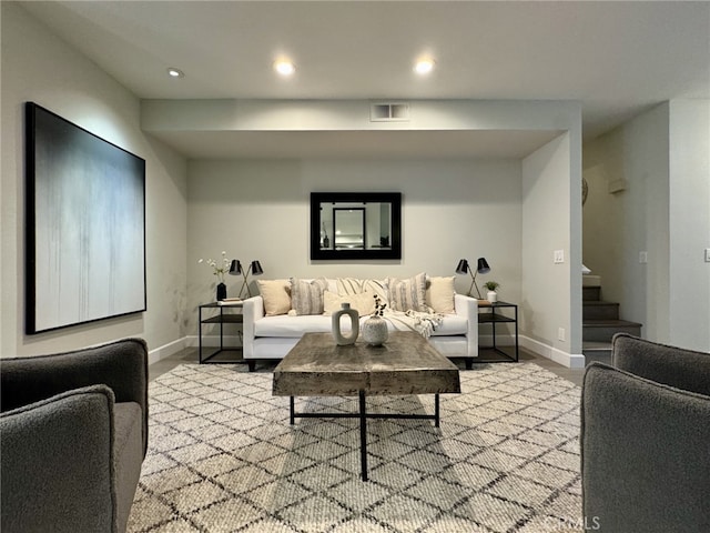 living room with stairs, recessed lighting, visible vents, and baseboards