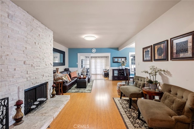 living room featuring hardwood / wood-style floors and a fireplace