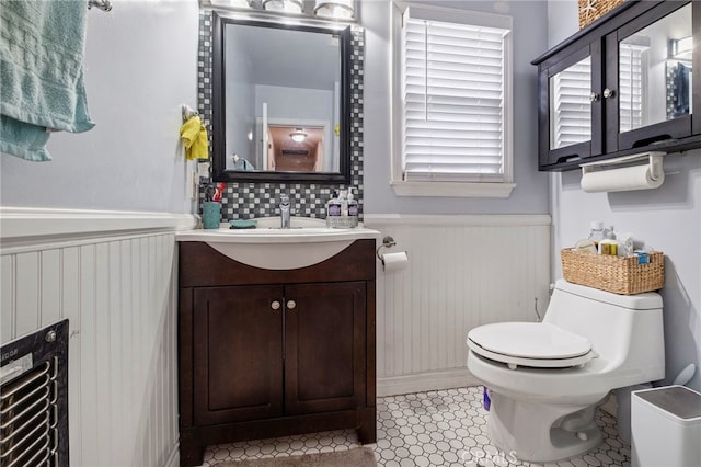 bathroom featuring vanity, toilet, and tile patterned flooring