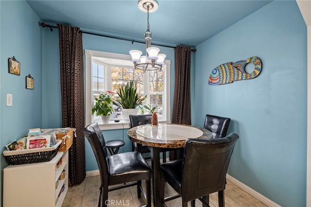 dining space featuring a chandelier