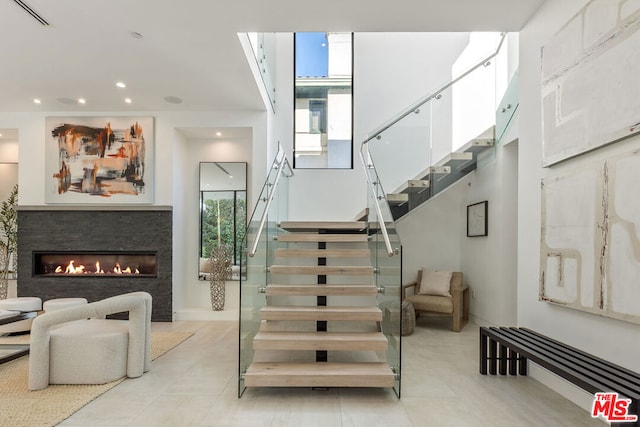 stairway with a fireplace