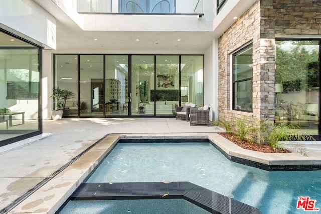 view of pool with a patio area