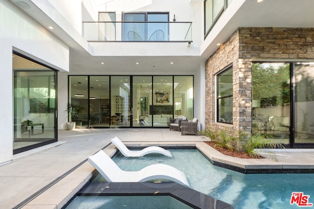 view of pool featuring a patio area