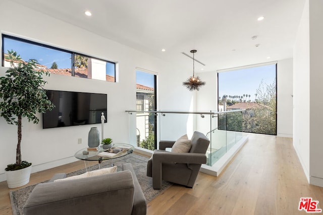 living room with plenty of natural light and light wood-type flooring