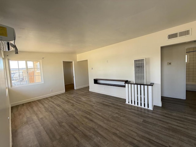 spare room featuring dark hardwood / wood-style flooring