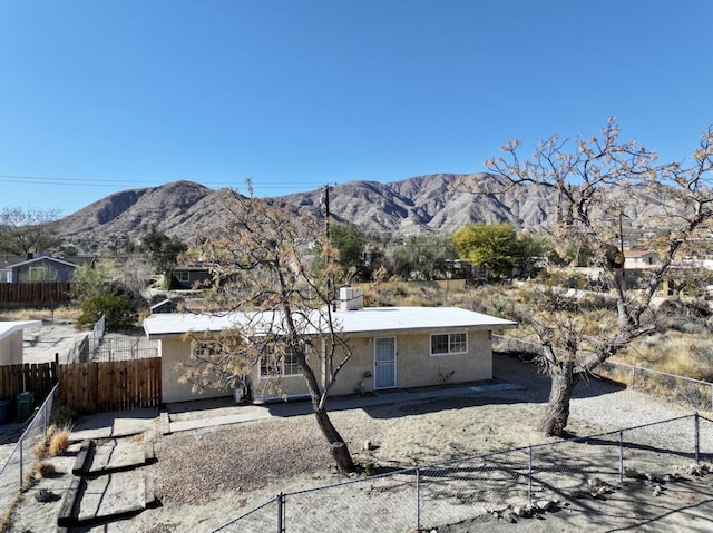 back of property featuring a mountain view