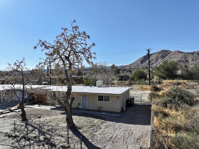 rear view of property with a mountain view