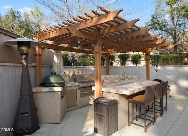 view of patio featuring area for grilling, a wet bar, and a pergola