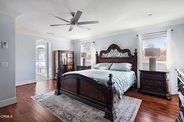 bedroom featuring dark hardwood / wood-style flooring, crown molding, and ceiling fan