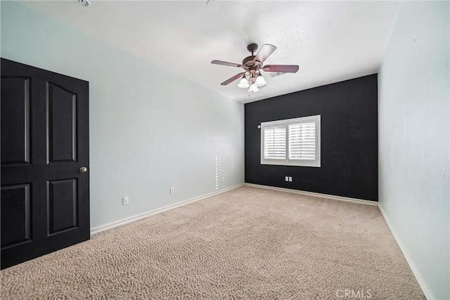 carpeted empty room with ceiling fan