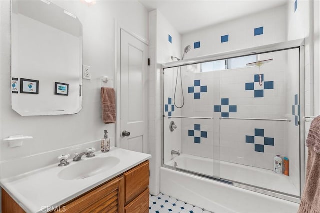 bathroom with enclosed tub / shower combo and vanity