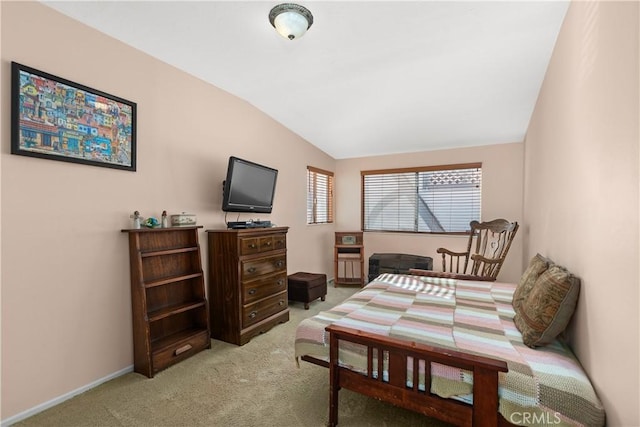 bedroom featuring light carpet and lofted ceiling