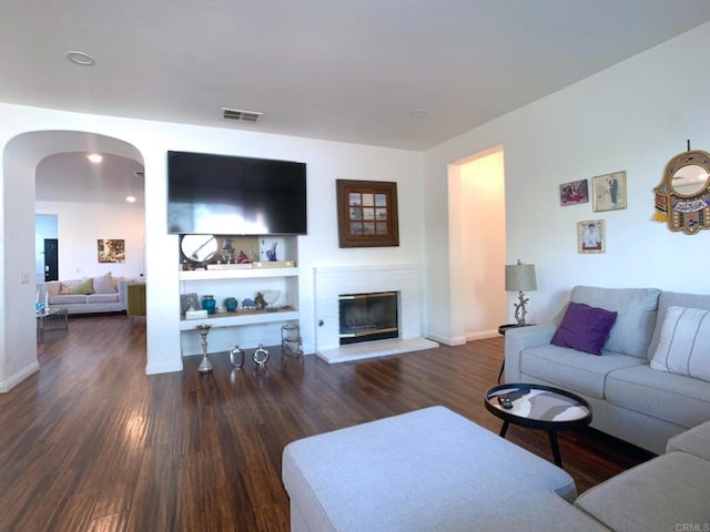 living room with dark hardwood / wood-style flooring