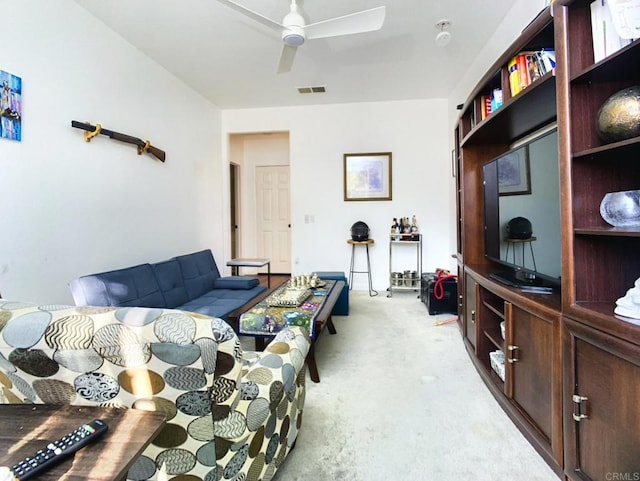 living room featuring ceiling fan and light carpet