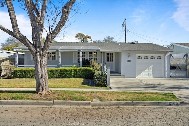 single story home featuring a garage and a front yard