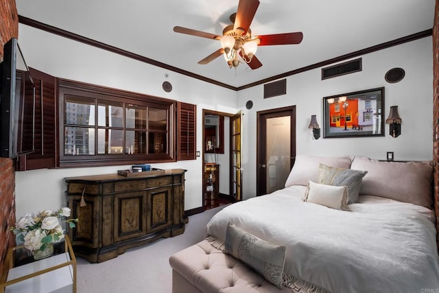 carpeted bedroom with crown molding and ceiling fan