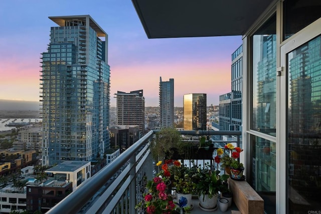 view of balcony at dusk