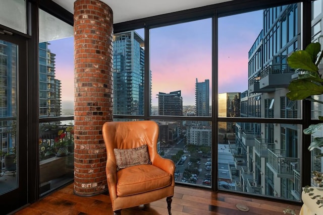 interior space featuring hardwood / wood-style flooring, floor to ceiling windows, and a wealth of natural light