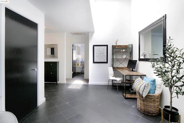 interior space featuring dark tile patterned floors