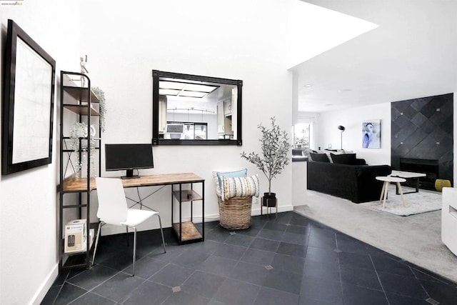 home office with dark tile patterned floors