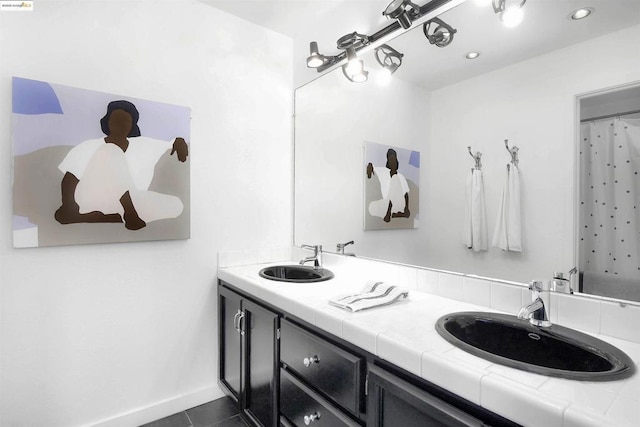 bathroom with tile patterned floors and vanity