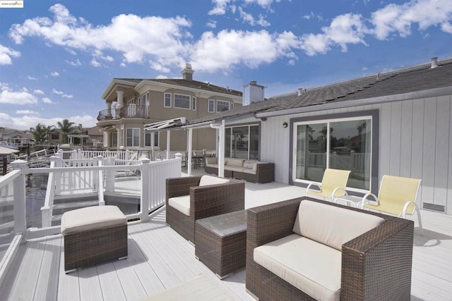 wooden terrace with outdoor lounge area