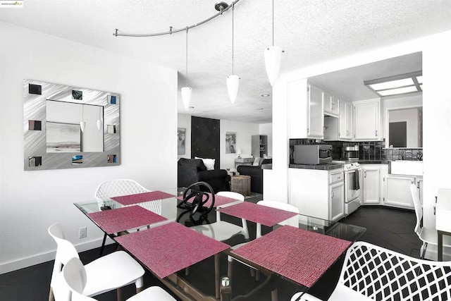 dining area with a textured ceiling