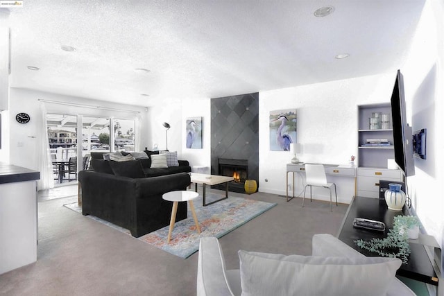 living room with a textured ceiling and a fireplace