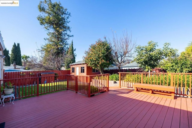 wooden terrace with an outbuilding