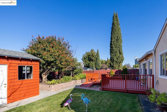 view of yard featuring a wooden deck