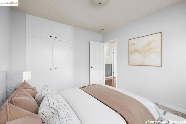 carpeted bedroom with a closet