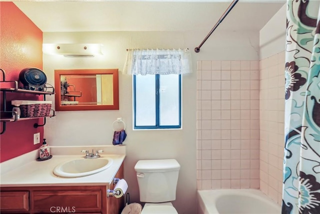 full bathroom featuring vanity, shower / tub combo with curtain, and toilet