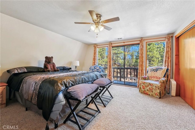 bedroom with carpet floors, access to exterior, and ceiling fan