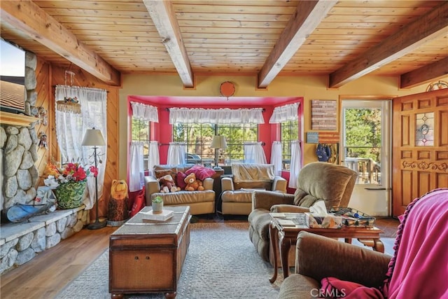 sunroom / solarium featuring wooden ceiling and a healthy amount of sunlight