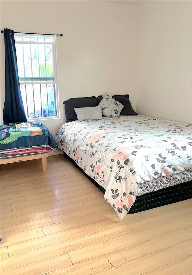 bedroom featuring wood-type flooring